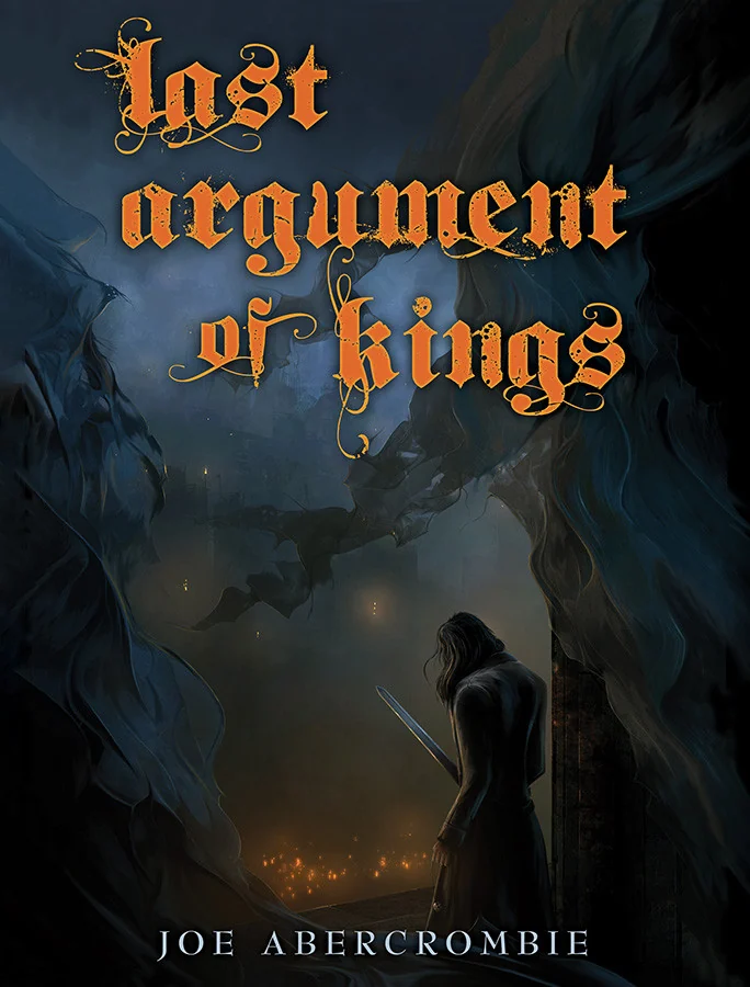 An alternate cover of Last Argument of Kings: a lone figure with a drawn sword stands on a dark ledge looking down a shadowed ravine toward the distant fires of a besieged city, with the title in orange gothic lettering above.